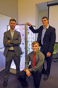 Hydro Grow LLC team members Scott Massey (left,) Jimmy Carlson and Ivan Ball pose in front of their hydroponic growing device. The team won first place at the recent Schurz Innovation Challenge at Purdue. (Purdue Research Foundation photo/Curt Slyder)
